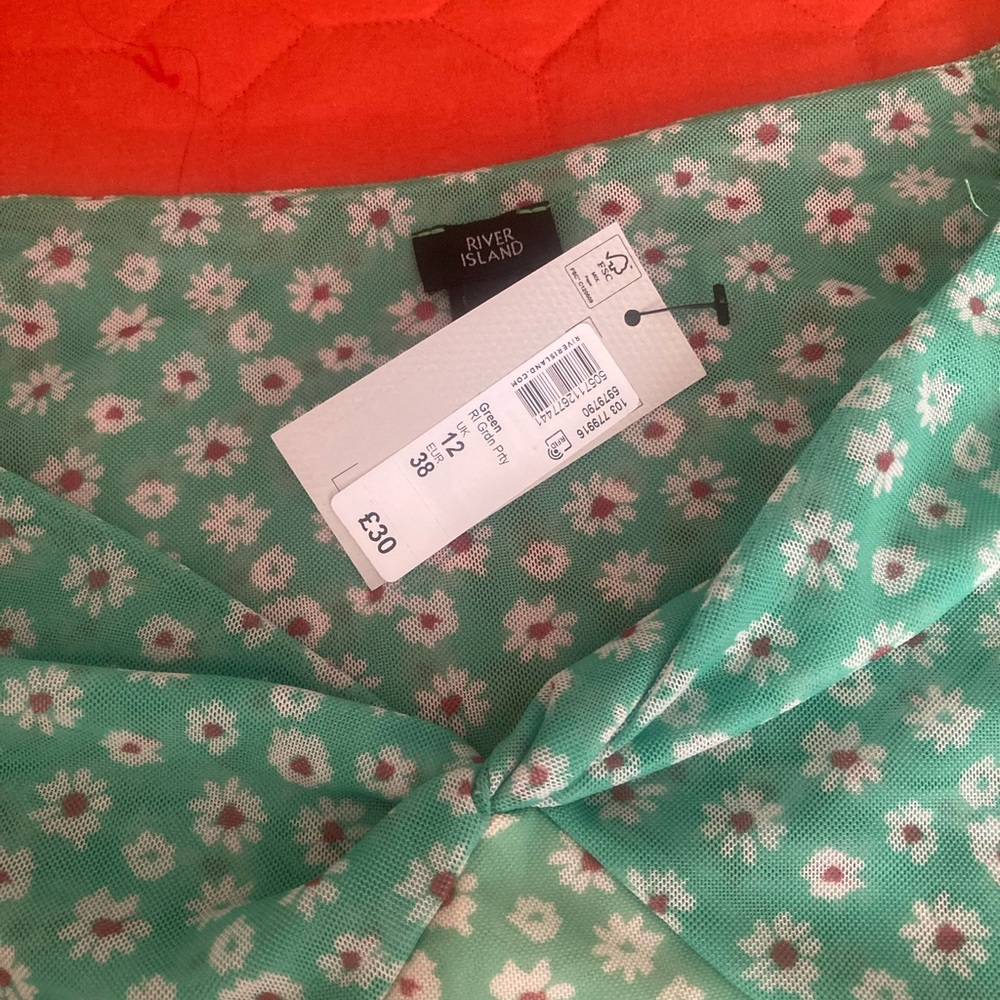 Green floral skater dress by River Island.